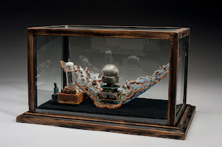 And then she invented a machine to make him change, Tempered Glass & Found Objects by Audrey Wilson