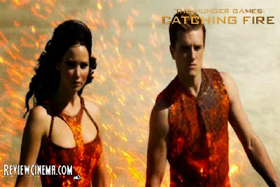 <img src="The Hunger Games : Catching Fire.jpg" alt="The Hunger Games : Catching Fire Katniss and Peeta in Parade">