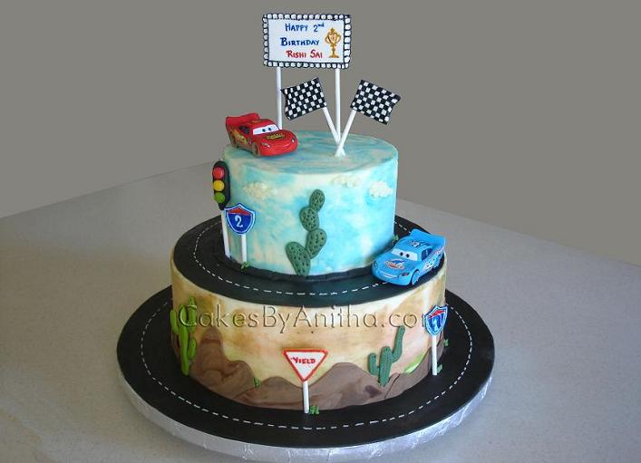 Toy cars topped the cake.