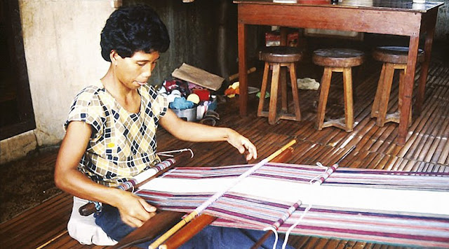 Kalinga weaver using traditional loom