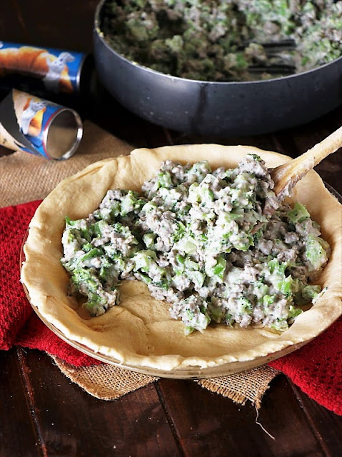 Filling Crescent Roll Crust with Beef-Broccoli Filling Image