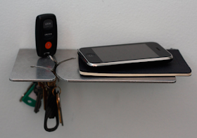 small shelf to hold keys, smartphone, etc.
