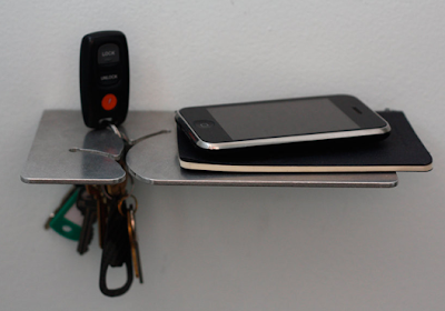 small shelf to hold keys, smartphone, etc.