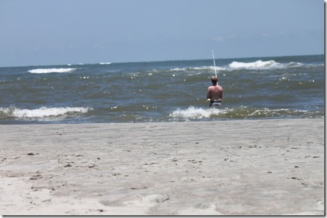 Evan in water fishing