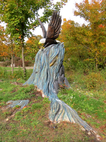 eagle carved into a tree stump