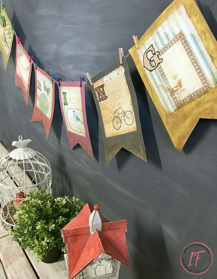 A DIY Vintage-Style Spring Banner easy dollar store craft perfect for a simple Spring paper garland to hang on a fireplace, mirror, or chalkboard.