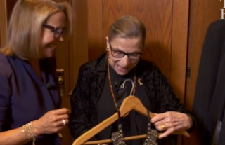 Ginsburg Appears To Wear ‘Dissent’ Collar On Bench 