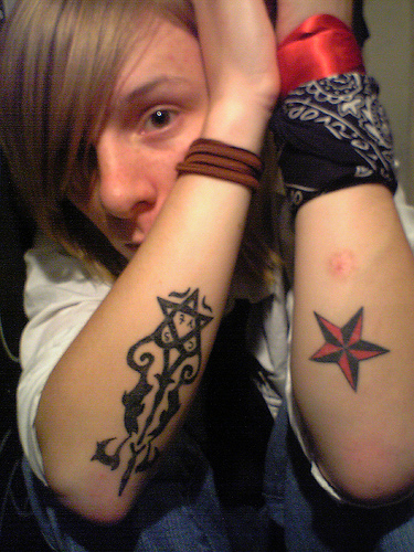 heartagram tattoo. side tattoos for guys. tattoos