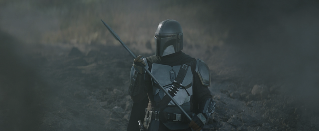 The Mandalorian with Beskar Spear in the Ruins of the Razor Crest Star Wars Disney Plus