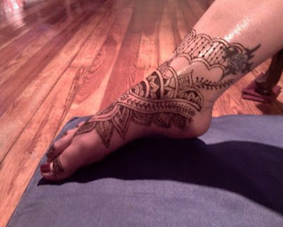 henna tattoo inside of foot