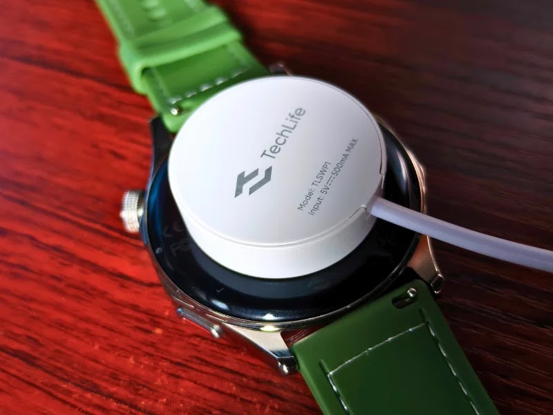 The TechLife Smart Watch P1 comes with a round magnetic charger.