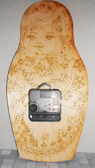 Matryoshka Wall Clocks with a surprise. On the back side of the clock is drawn (scorched) a girl-Matryoshka  that you or your child can colorize by yourself. 