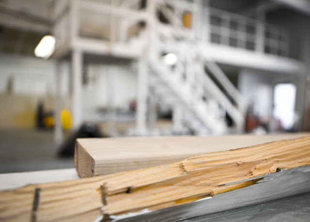 Scrap wood with blurred shop background