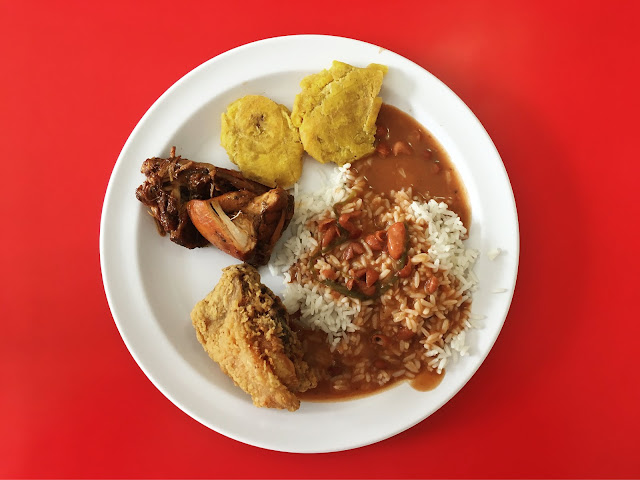 La Bandera lunch plate: Pollo Guisado, tostones, rice and beans with a little fried chicken for good measure.