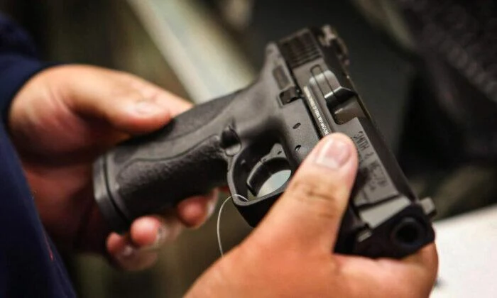 A customer shops for a pistol in Tinley Park, Illinois, on Dec. 17, 2012.