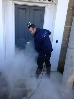 Gavin jet washing the stone floor