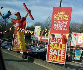 Inflatable advertising man at United Carpets and Beds