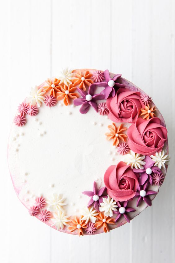 Inspired by the colors of an autumn sunset, I created this flirty, flower cake. I combined my favorite watercolor buttercream technique with easy piped buttercream flowers in this How to Make a… Inspired by the colors of an autumn sunset, I created this flirty, flower cake. I combined my favorite watercolor buttercream technique with easy piped buttercream flowers in this How to Make a…