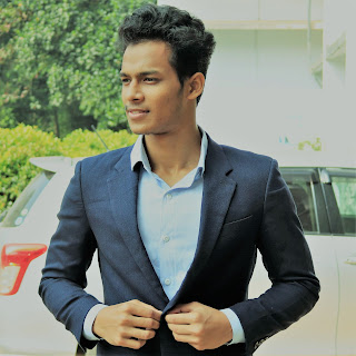 Shorov Nath Shuvo wearing a black suit