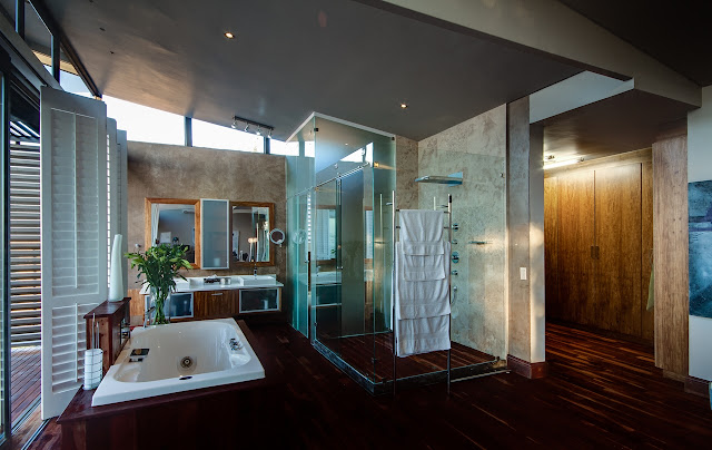 Large modern bathroom with glass shower 