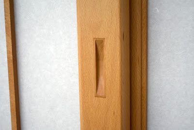 Door pull inlaid into shoji screen stile.