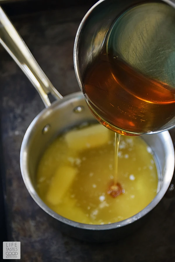 Pouring the honey into the butter brown sugar mixture for the brown sugar glaze to coat the honey baked ham