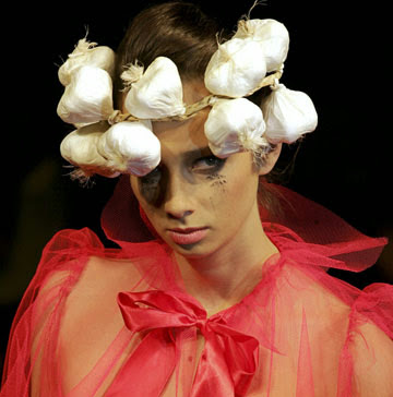 Model with garlic around her head