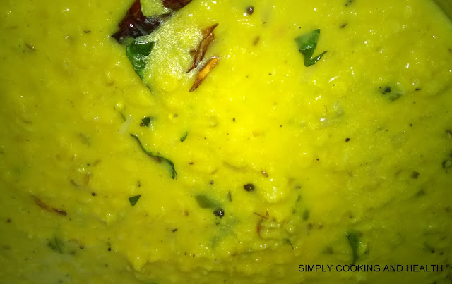Dal curry stirred with tempered items.