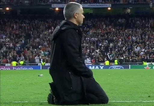 José Mourinho watches the shootout from his knees