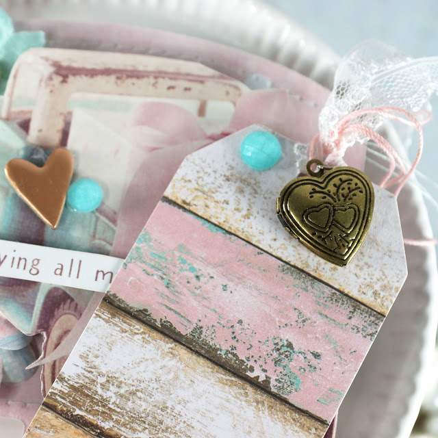 Heidi Swapp Memorydex Valentine's advent calendar made with the Prima With Love collection by Frank Garcia; fussy cut vintage truck with gift tag and die cut card; decorated with ephemera, chipboard stickers, paper flowers, lace trim and locket charm