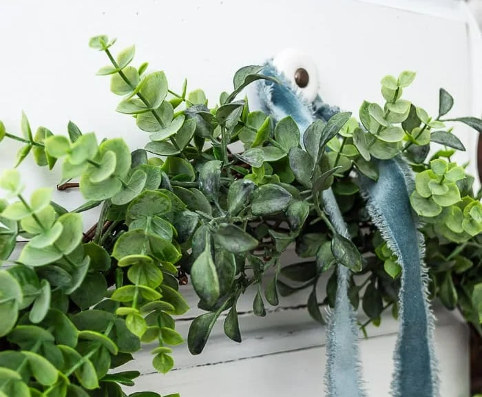 close up of greenery on wreath