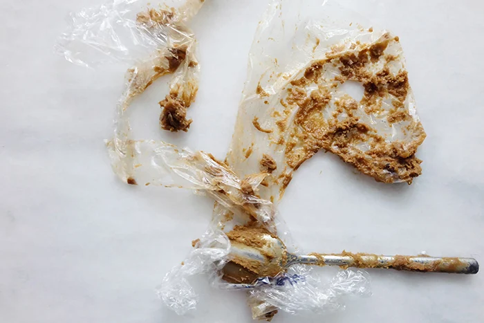 sticky cookie batter in plastic wrap