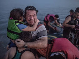 http://www.independent.co.uk/news/world/europe/kos-crisis-the-story-behind-the-photograph-of-a-syrian-father-shared-by-thousands-online-10461933.html