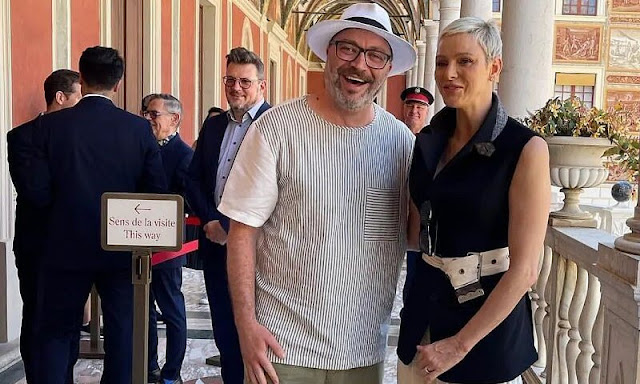 Princess Charlene wore a sleeveless single breasted jacket by Louis Vuitton, and pants by same brand