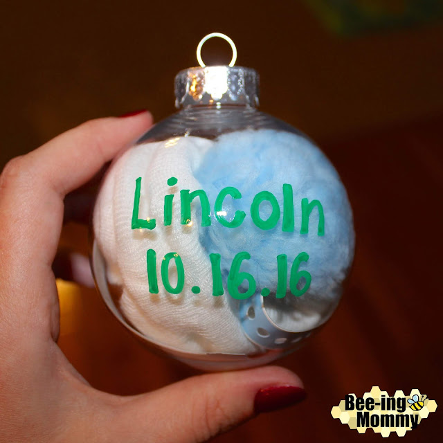 Baby's First Keepsake Ornament, baby ornament, keepsake ornament, keepsake, personalized ornament, hospital hat ornament, baby's first ornament, ornament idea, newborn baby ornament, first Christmas ornament, scrapbook ornament, meaningful ornament, baby boy ornament, baby's first Christmas, baby, paint pen craft, DIY