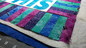 Pin basting a mini quilt with Hobbs batting