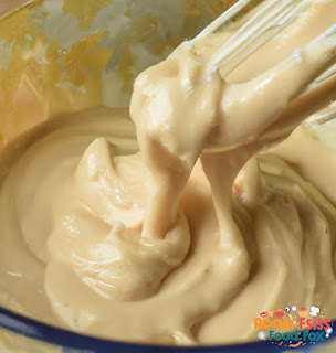 Close-up image of the tahini sauce being whisked together in a bowl