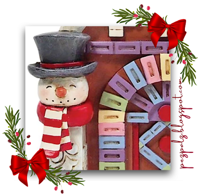 Jim Shore PEZ Snowman with Gingerbread house holiday figurine with Santa and Snowman close up 2