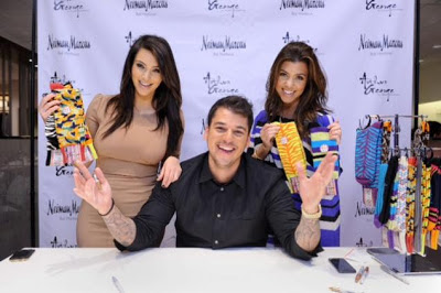 Rob Kardashian, with sisters Kim (l.) and  Kourtney, reveals his Arthur George line of high-fashion men's socks at Neiman Marcus.