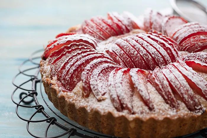 Dust german plum cake with icing sugar