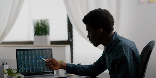 Crypto miner looking at computer screen
