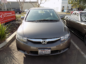 2011 Honda Civic with dented hood & bumper after repairs at Almost Everything Auto Body.