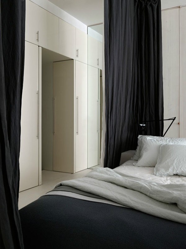 Bed in small apartment in New York by Rick Joy