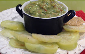 bowl of guacamole dip and sliced tomatillo