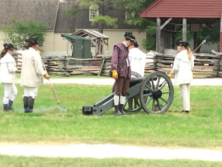 Colonial Williamsburg Canon Team prepare to fire the gun