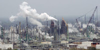 The future of refineries such as Exxon Mobil’s in Baton Rouge, Louisiana, could be going up in smoke because of low oil prices. (Image Credit: W Clarke via Wikimedia Commons) Click to Enlarge.