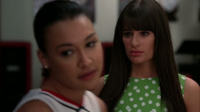 Santana angrily turning away from Rachel who looks sad