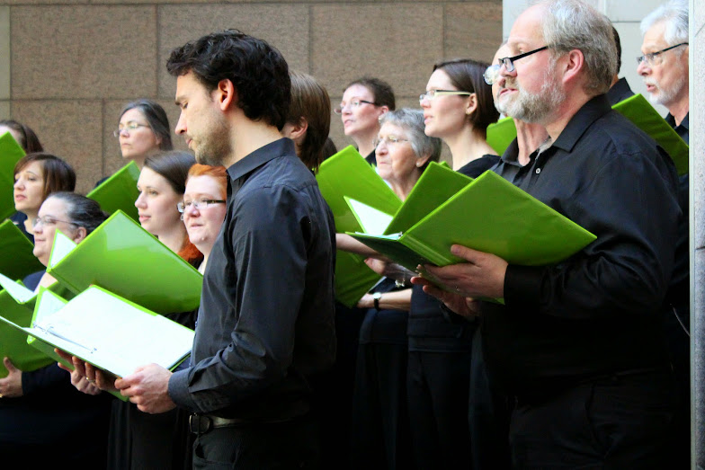 Rae, soprano, stands in the second row third to the right