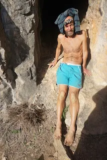 Me at the entrance of the cave  with pullpver on the head
