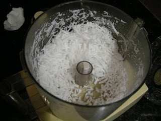 grating coconut in the Cuisinart, La Ceiba, Honduras